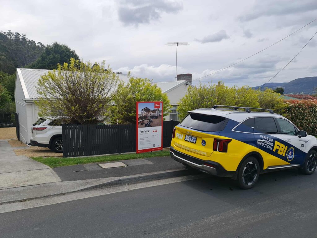 FBI's car parked in front of a house for sale before pre-offer inspection