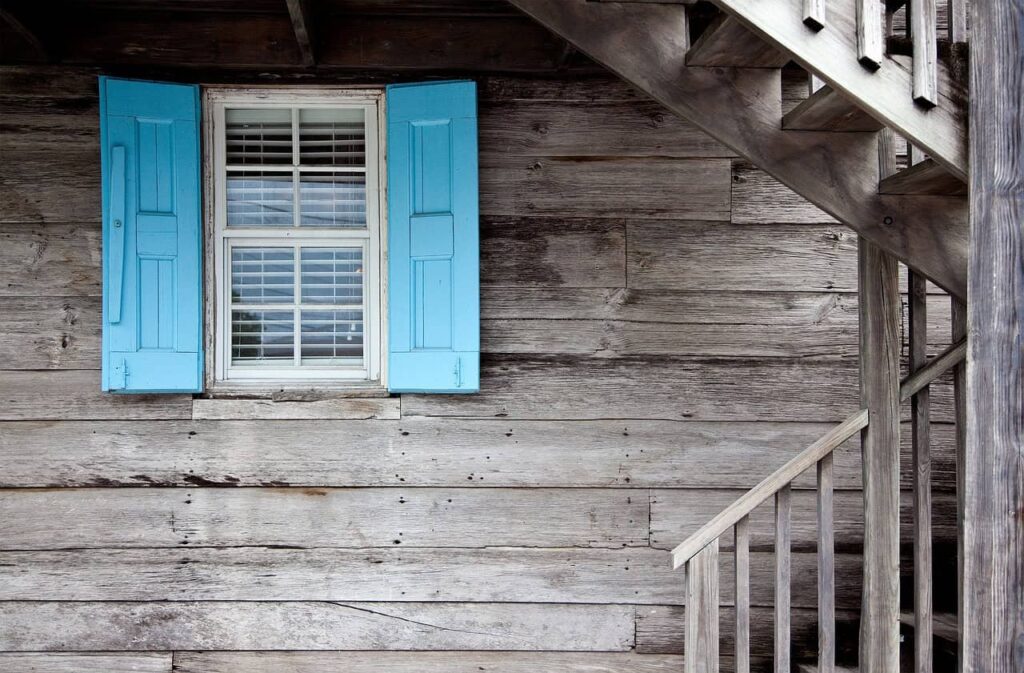 wooden house with blue windows