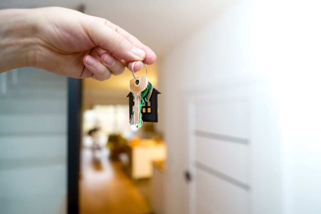 hands of someone holding house keys