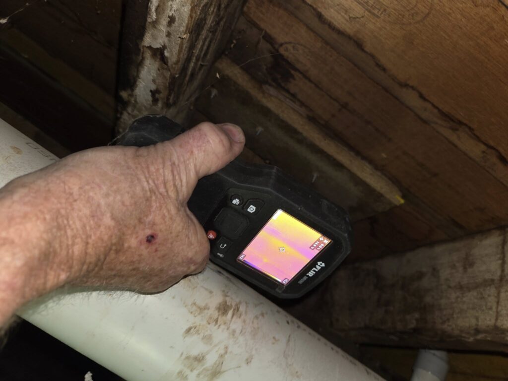 thermal imaging camera being used in a building inspection